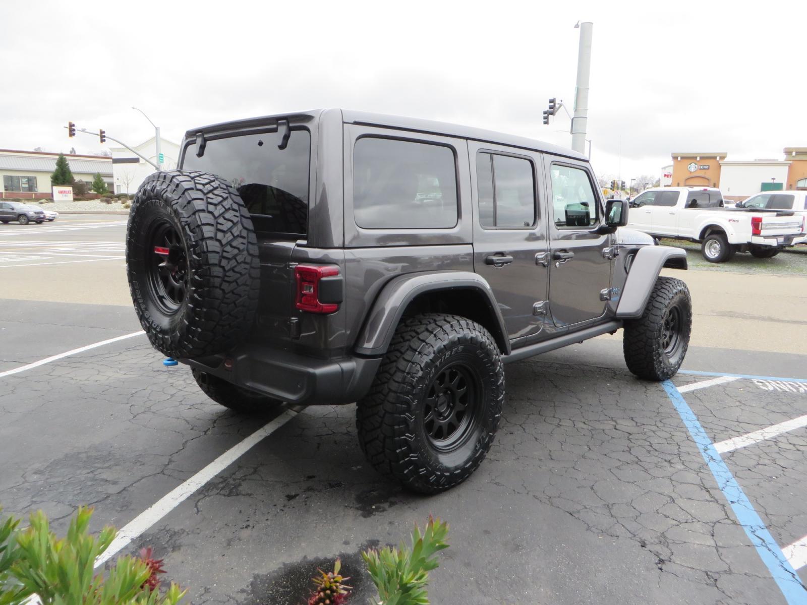 2021 CHARCOAL /BLACK Jeep Wrangler Unlimited Rubicon 4XE 4d SUV 4wd (1C4JJXR60MW) with an 2.0L L4 DOHC 16V TURBO engine, automatic transmission, located at 2630 Grass Valley Highway, Auburn, CA, 95603, (530) 508-5100, 38.937893, -121.095482 - 4XE Rubicon sitting on a Zone offroad suspension system, Fox shocks, 37" Toyo RT trail tires, 17" Method Race wheels, Teraflex Hd tire carrier, and Flat tow ready. - Photo #4